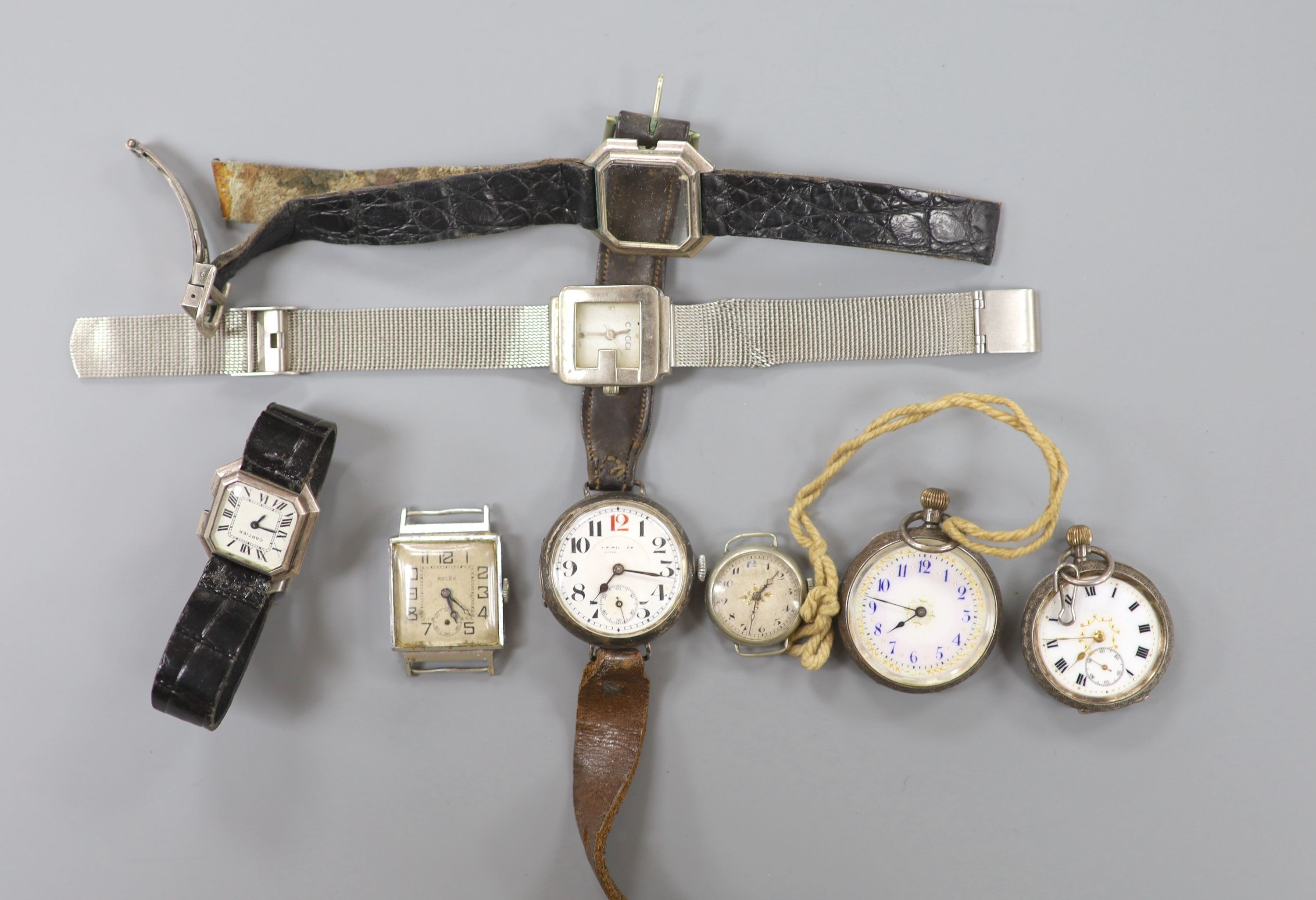 A gentleman's early 20th century silver trench wrist watch by J.W. Benson, four other wrist watches, two silver or white metal fob watches and a wrist watch case.